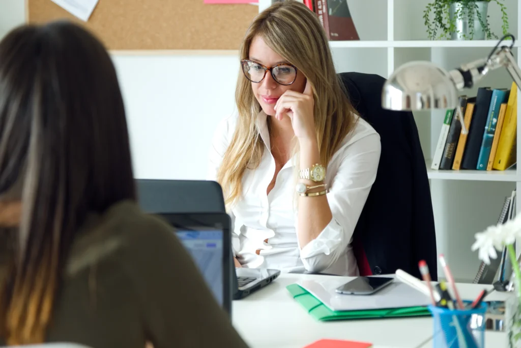 two-business-woman-working-her-office-scaled